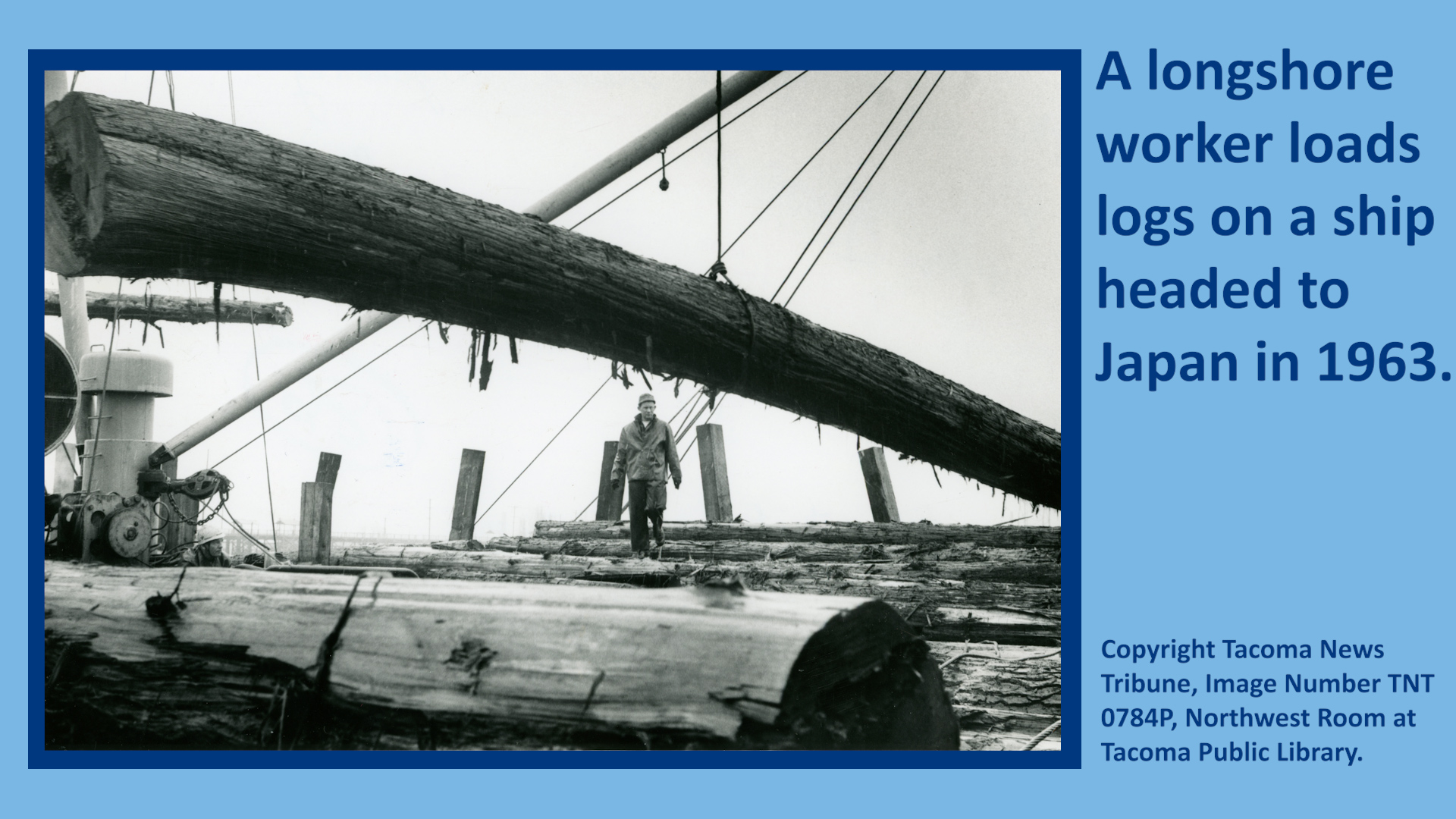 A longshore worker loads logs on a ship headed to Japan in 1963.